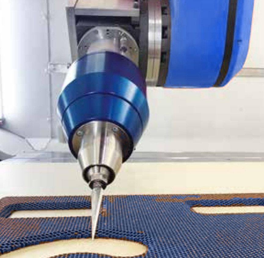 Ultrasonic cutting head machining a honeycomb panel